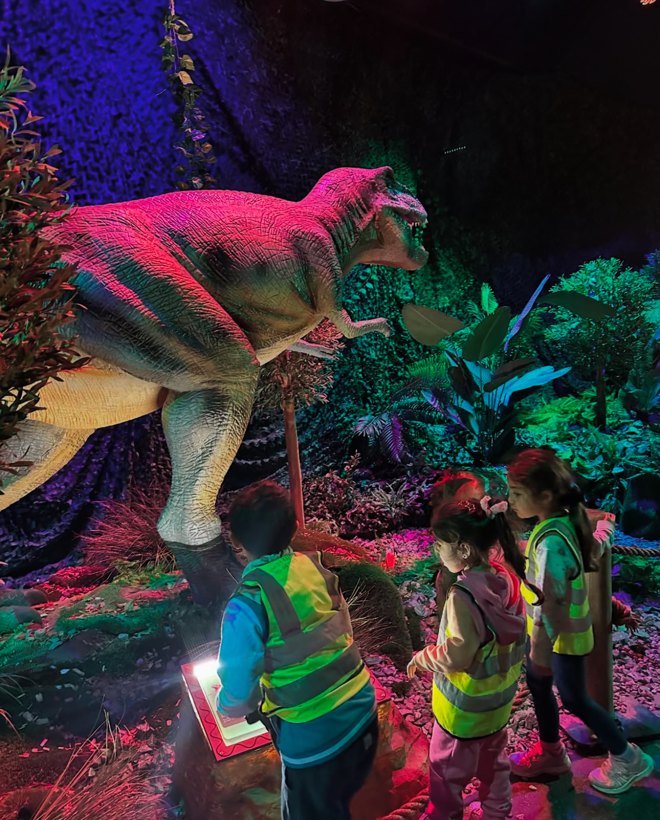 Preschoolers on a field trip, learning about dinosaurs at a local museum.